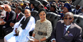 President Mugabe and his Wife Grace Mugabe await his inauguration in 2014. Photo Credit: Flickr (GovernmentZA) Creative Commons.