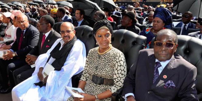 President Mugabe and his Wife Grace Mugabe await his inauguration in 2014. Photo Credit: Flickr (GovernmentZA) Creative Commons.