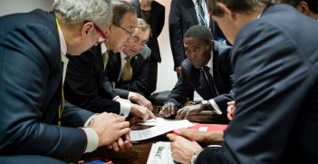 Recent discussions on the text, one hour before it is presented to the committee of Paris, Ban Ki Moon and the UN team, and François Delattre, Ambassador, Permanent Representative of France to the United Nations. Photo Source: COP 21 (Flickr). Creative Commons.