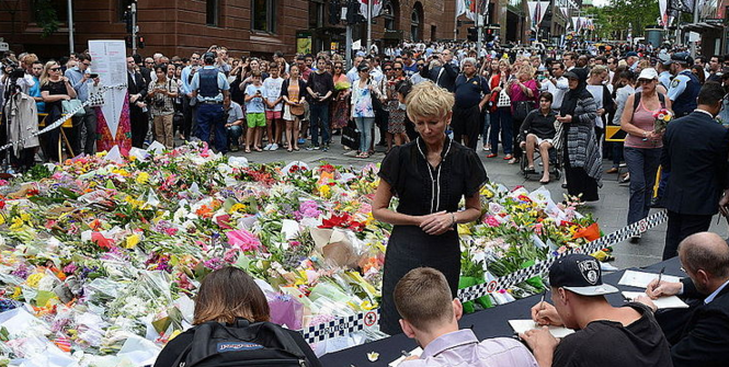 People signing condolences books after Lindt Café siege, Martin Place, Sydney, 2014-12-16. Photo Source: Wikimedia Commons. Creative Commons.