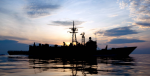 HMAS DARWIN at sunset in the South China Sea sailing off the coast of Pulau Tioman during Exercise Bersama Lima 2009. Photo Source: Royal Australian Navy (Flickr). Creative Commons