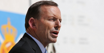 Australian Prime Minister Tony Abbott addresses the crowd at Multi-National Base Tarin Kot on Oct. 28, 2013 in Uruzgan, Afghanistan. Photo Source: US Embassy Kabul Afghanistan (Flickr). Creative Commons.