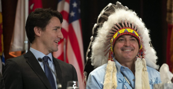 Justin Trudeau and AFN national chief Perry Bellegarde talk before the beginning of the Assembly of First Nations Special Chiefs Assembly in Québec.