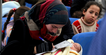 A Syrian refugee filling an application at the UNHCR registration center in Tripoli, Lebanon. Photo Source: World Bank Photo Collection (Flickr). Creative Commons.