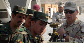 Australian Army sergeant teaches Afghan Nation Army officers artillery setup (Wikimedia Commons)