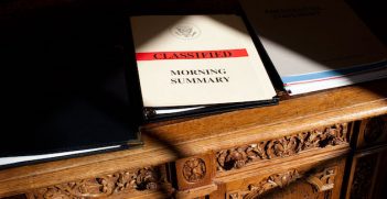 A classified document is framed by shadows on the Resolute Desk in the Oval Office during a meeting with Kenyan professor Wangari Maathai, Oct. 5, 2009.  (Official White House Photo by Pete Souza)

This official White House photograph is being made available only for publication by news organizations and/or for personal use printing by the subject(s) of the photograph. The photograph may not be manipulated in any way and may not be used in commercial or political materials, advertisements, emails, products, promotions that in any way suggests approval or endorsement of the President, the First Family, or the White House.