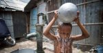 A child washes himself in Kallayanpur, a slum in Bangladesh's capital, Dhaka. 