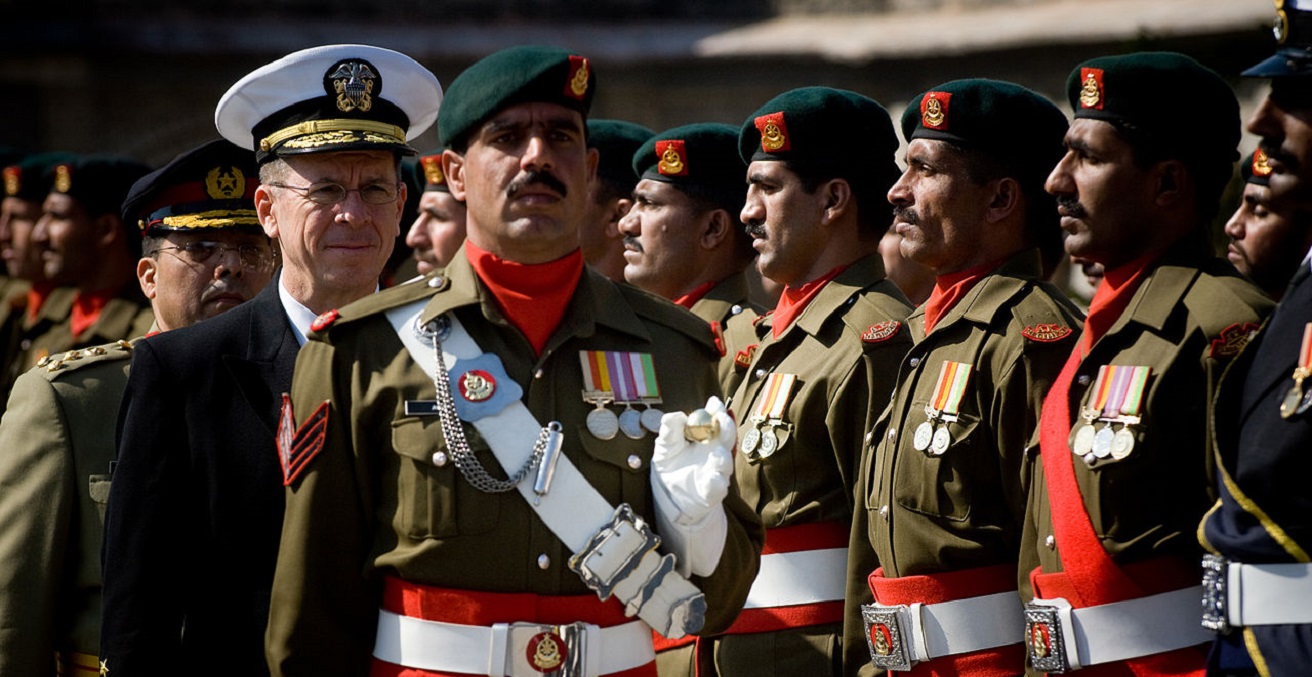 Pakistani soldiers stand at an attention 