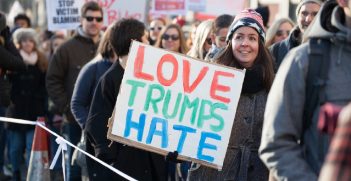 A woman protests against Trump