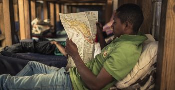 Tlaxcala State, Apizaco, migrant shelter. A migrant is reading a brochure of practical advice for migrants he just received from the ICRC.