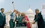 US representatives smash a Toshiba product. Source: Kinja image, Gizmodo