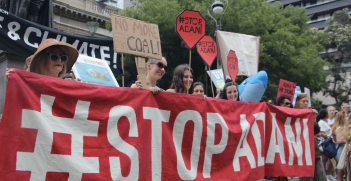 Protesters in Melbourne opposed to the Adani Carmichael Mine project. Source: Takver on Flickr, https://bit.ly/2TRtHmI