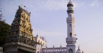 A Hindu temple stands next to a mosque in a neighbourhood in Bangladore. Indian tradition has long been influenced by the co-mingling of religious sources. Source: Mark Pritchard on Flickr.