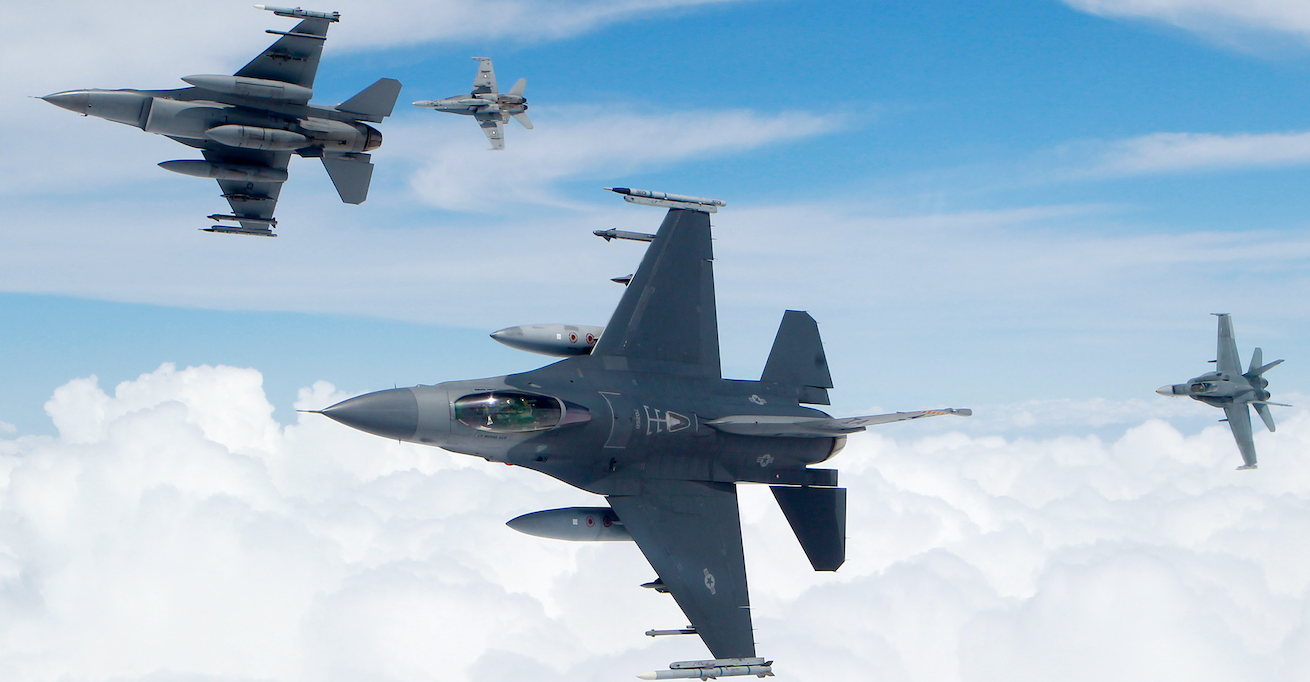 Royal Australian Air Force F/A-18 Hornets and United States Air Force F-16's break formation. Source: Flickr, Robert Sullivan http://bit.ly/32rcyWH