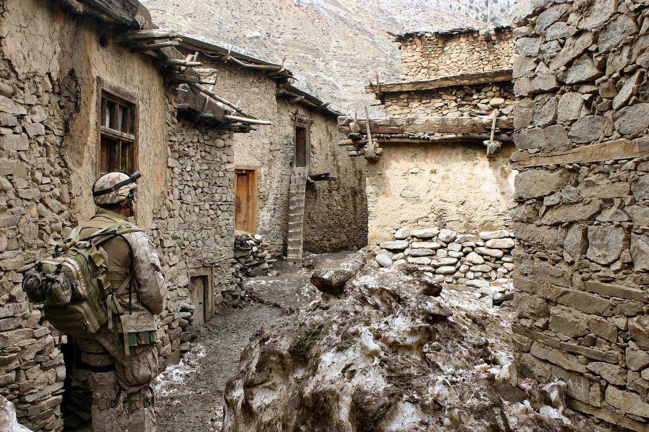 Marine in Ruined Afghan Village. Photo by Wiki Images. Source: https://bit.ly/2s4dxyl