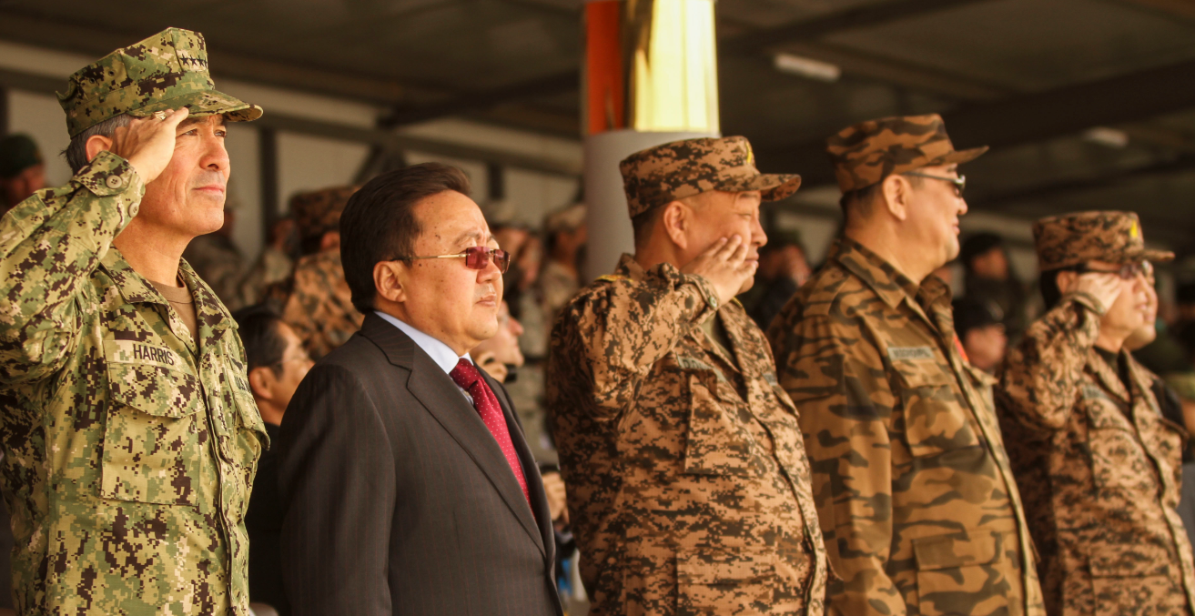 Multinational participants salute distinguished visitors and the president of Mongolia Tsakhiagiin Elbegdorj, during the opening ceremony of Khaan Quest 2016. Khaan Quest 2016 is an annual multinational peacekeeping operations exercise.  Source: Cpl. Hilda Becerra 