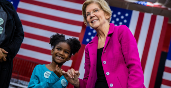 Senator Elizabeth Warren makes a pinkie promise with a young girl at a rally at Clark Atlanta University in Atlanta, GA on Thursday, November 21st, 2019. Source: Elizabeth Warren https://bit.ly/3d4nZsK