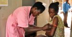 Hellen, a nurse in the ANC clinic of Jinja Regional Referral Hospital assesses the nutritional status of Proskovia, a 20 year old woman who is 3 months pregnant with her third child. Source: Kate Consavage/USAID https://bit.ly/2NPGXrL