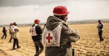 A group of farmers sow wheat seeds in the presence of ICRC staff. Photo supplied by the ICRC.