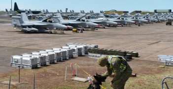 Royal Australian Air Force (RAAF) Leading Air Craftsman Jayden O'Shea, No. 2 Security Forces Squadron military dog handler, and his dog, Deca, watch over an aircraft pad during Exercise Diamond Storm at RAAF Base Darwin, Australia, May 8, 2019. Source: U.S. Air Force photo by Staff Sgt. Joshua Edwards https://bit.ly/2COn8PD