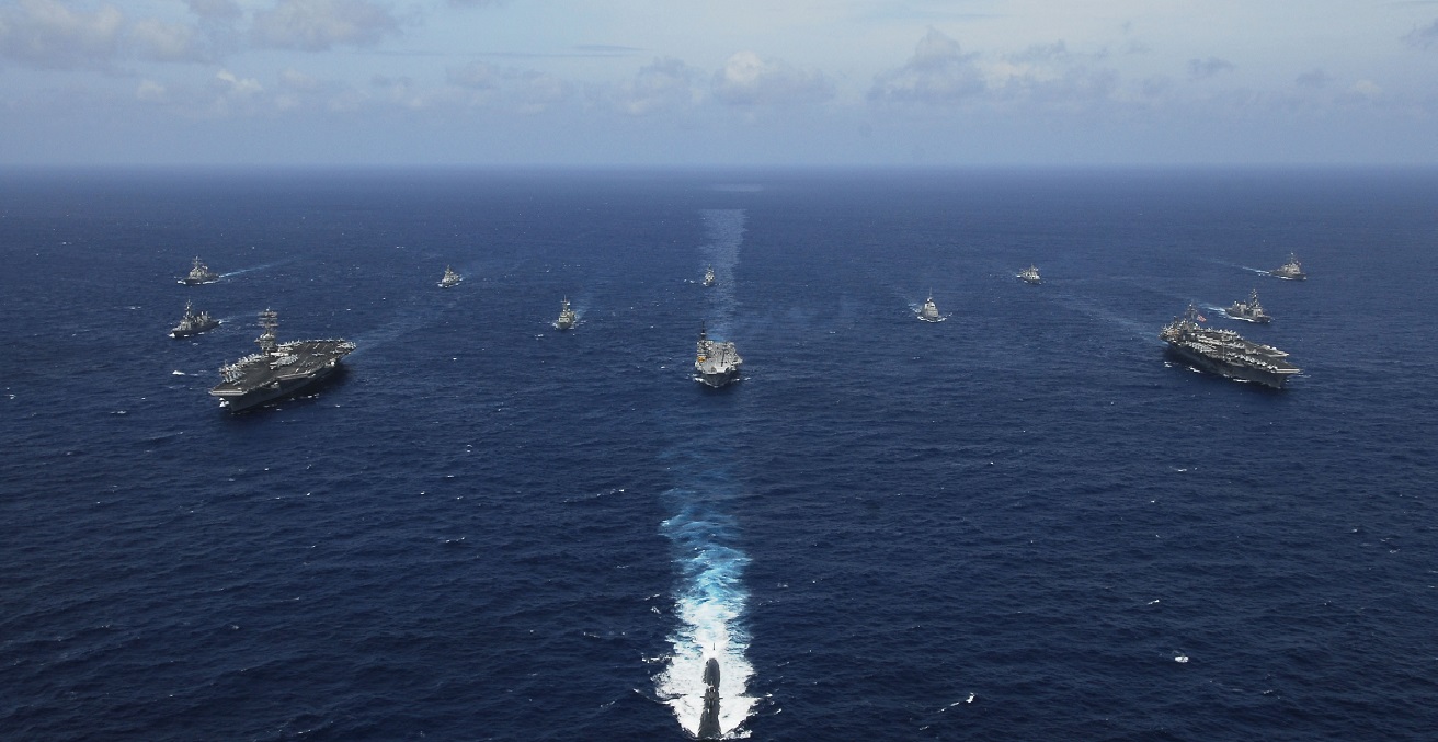 USS KITTY HAWK, At sea (Sept. 5, 2007) Naval ships from India, Australia, Japan, Singapore, and the United States steam in formation in the Bay of Bengal during Exercise Malabar. Source: Mass Communication Specialist Seaman Stephen W. Rowe https://bit.ly/2BOaP5o