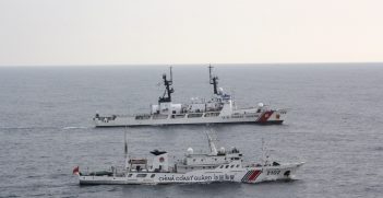 The Coast Guard Cutter Morgenthau and China coast guard vessel 2102 steam alongside each other during the transfer of the fishing vessel Yin Yuan in the North Pacific Ocean June 3, 2014. The Morgenthau crew was patrolling in support of Operation North Pacific Guard, the Coast Guard's component of a multi-lateral fisheries law enforcement operation designed to detect and deter illegal, unreported and unregulated fishing activity. Source: U.S. Coast Guard Cutter Morgenthau https://bit.ly/30UyXgo