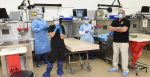 Office of the Armed Forces Medical Examiner personnel pose for a photo in the autopsy suite at the Armed Forces Medical Examiner System on Dover Air Force Base in Delaware, USA. Source: U.S. Navy photo/Mass Communication Specialist 2nd Class Samantha Thorpe https://bit.ly/2XWuLuo