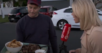 Prime Minister Jacinda Ardern's partner Clarke Gayford offers fried fish and venison bites to journalists waiting outside Ardern's suburban Auckland home. TVNZ.