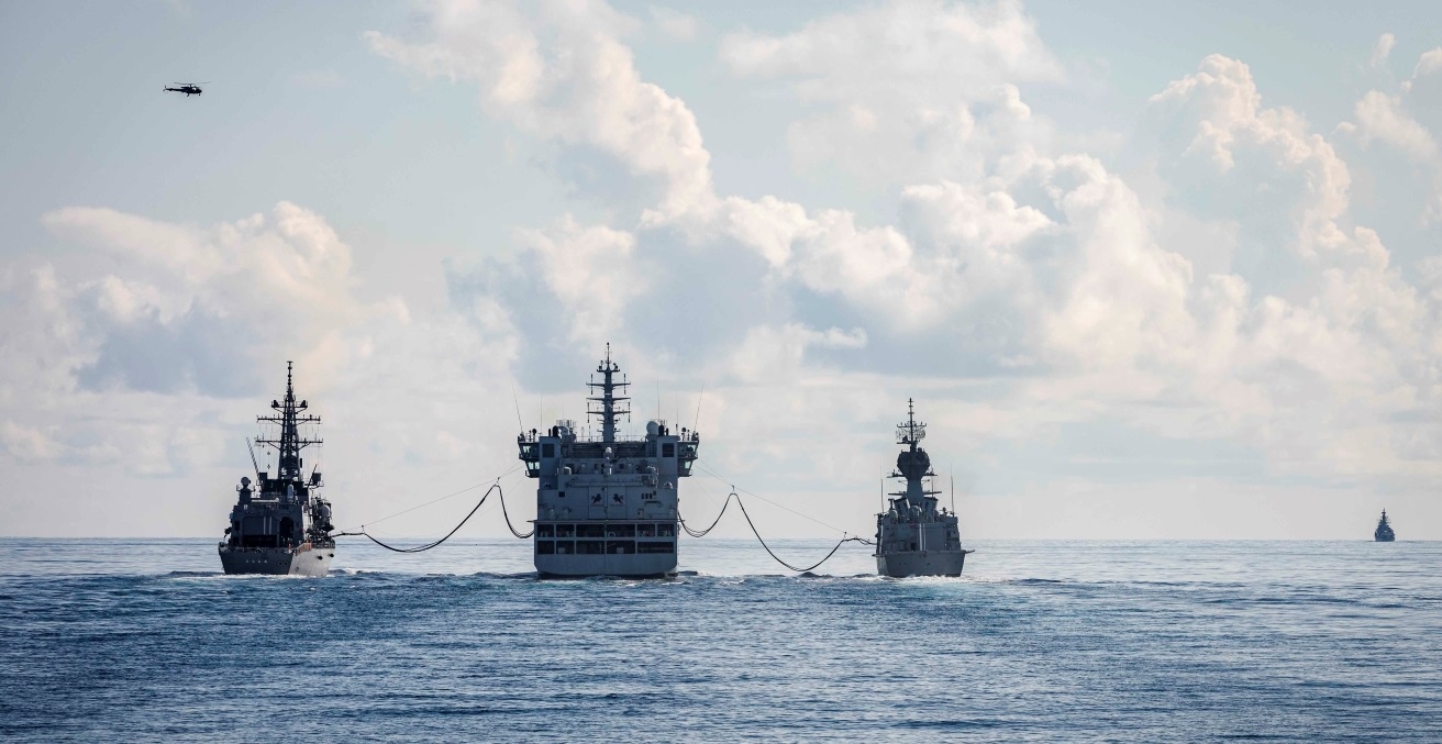 The Takanami-class destroyer JS Oonami (JS 111), far left, and the Royal Australian Navy Anzac-class frigate HMAS Ballarat (FFH 155) conduct a replenishment-at-sea with the Indian Navy Deepak-class fleet tanker INS Shakti (A 57) during Malabar 2020. Source: US Navy/Mass Communication Specialist 2nd Class Markus Castaneda https://bit.ly/36eLg8O